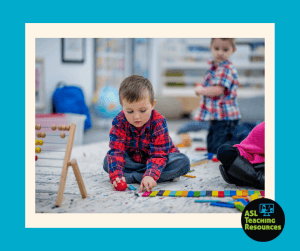 autistic child lining up toys