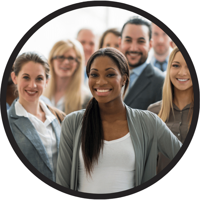 Group of diverse professionals smiling, with a confident woman in the foreground wearing a gray cardigan and white top, standing in front of her colleagues. Interpreter Request