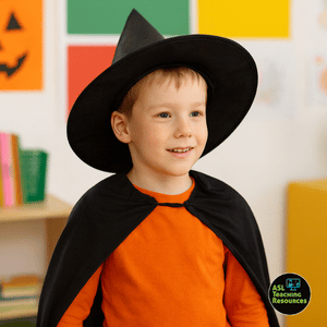 Child in a black witch hat and cape wearing orange shirt, classroom background, is ready for ASL for Halloween Fun Activities