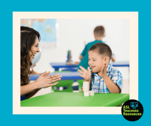 boy-one-on-one-autism-with-teacher-sign=language-work