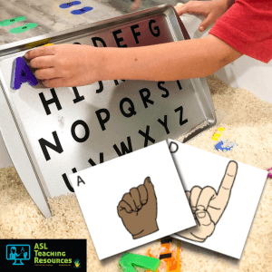 Kid playing Alphabet sensory bin